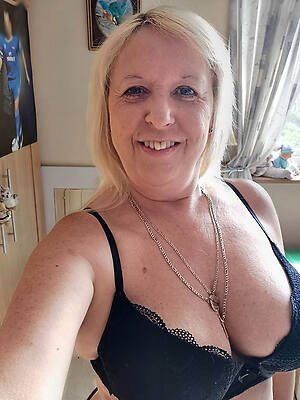 American mature women in bra shows off everything